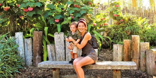 Mother holding her son outdoors